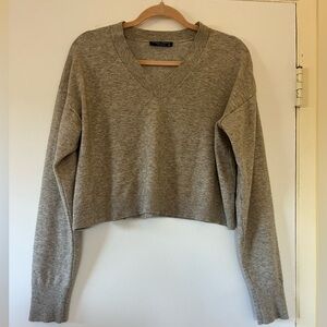 Cropped cream V-neck sweater